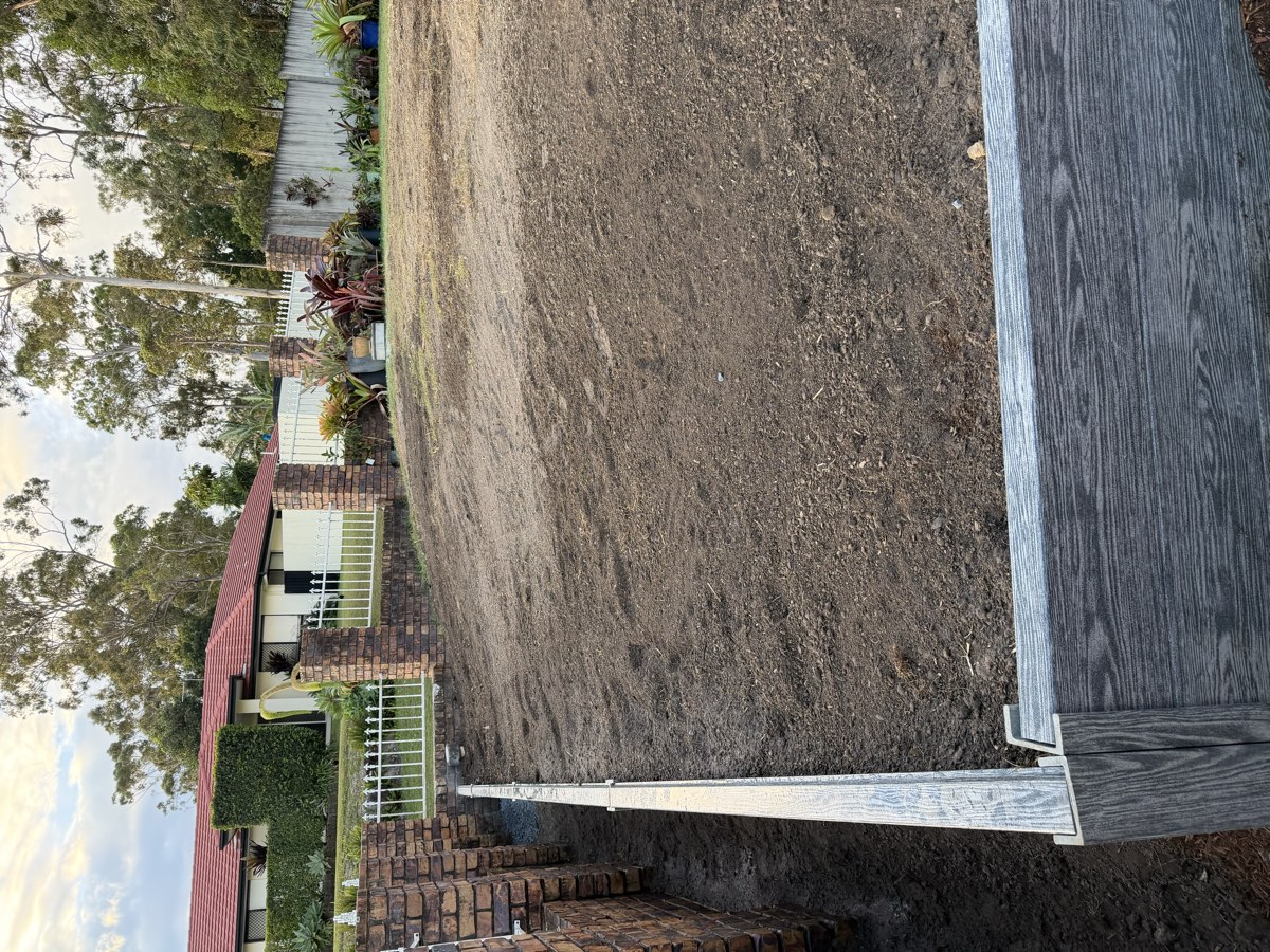 Finished retaining wall and level yard, ready for landscaping