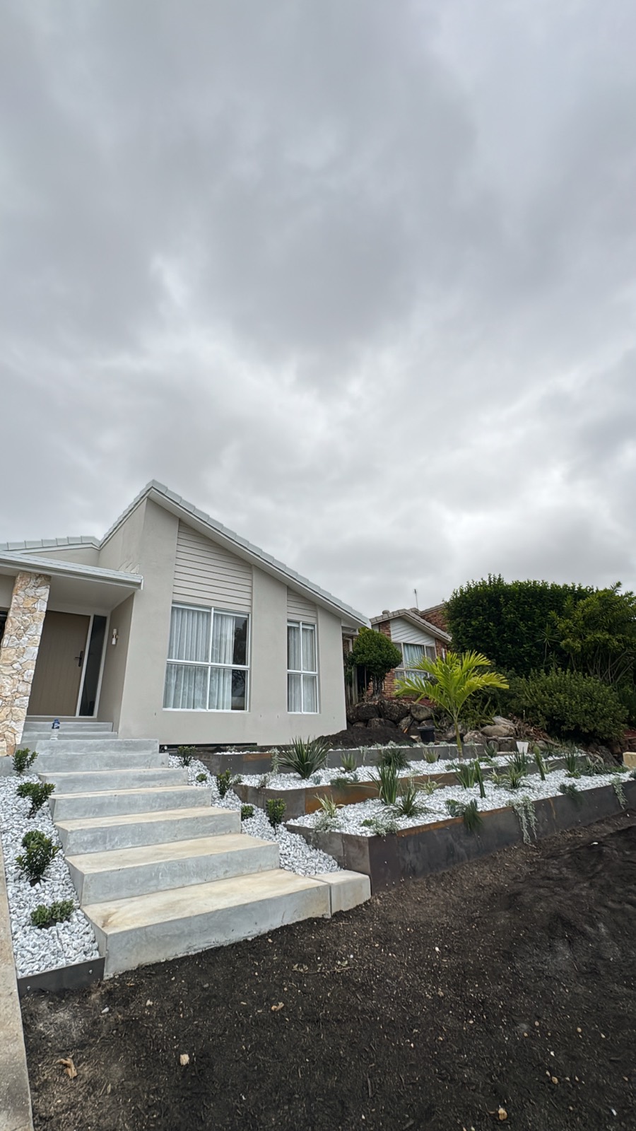 Sandstone steps and tiered retaining, finished front yard